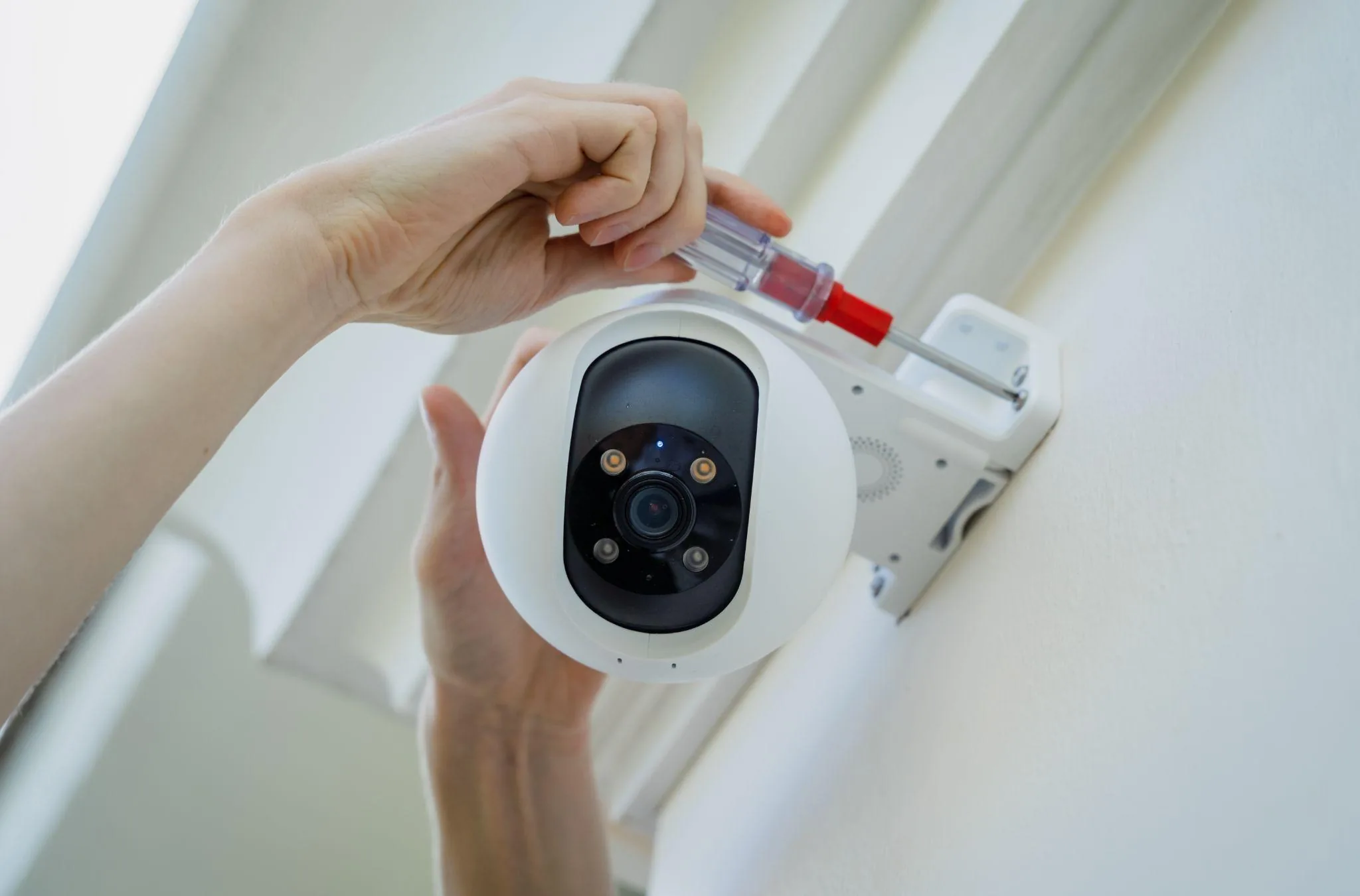 Security camera installer working on a Victoria TX home security camera system