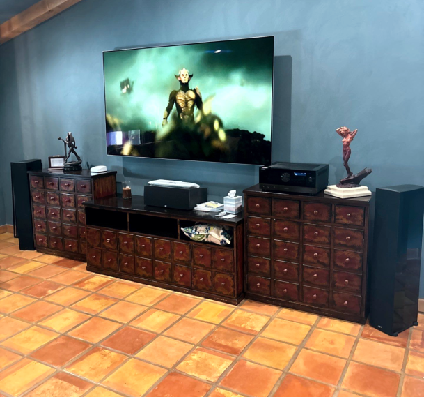 Home entertainment setup with large TV and speakers