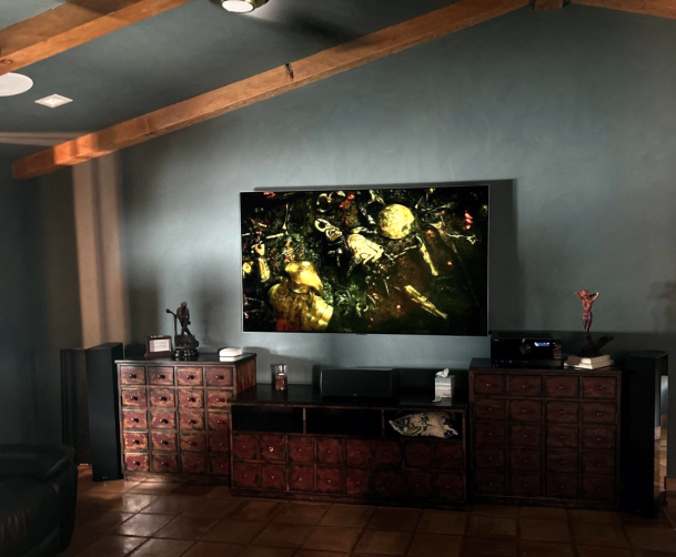 Home entertainment setup with large wall-mounted TV
